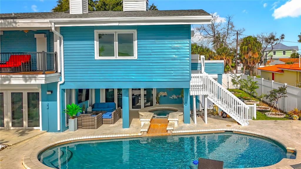 14186 West Parsley Drive Madeira Beach, FL 33708 - Photo 51 of 57 a view of a house with backyard porch and sitting area