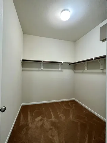 an empty room with a empty space and window