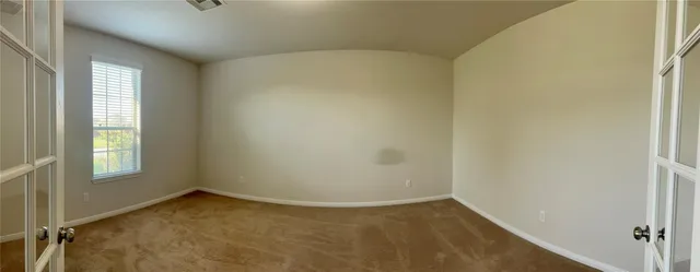 an empty room with windows