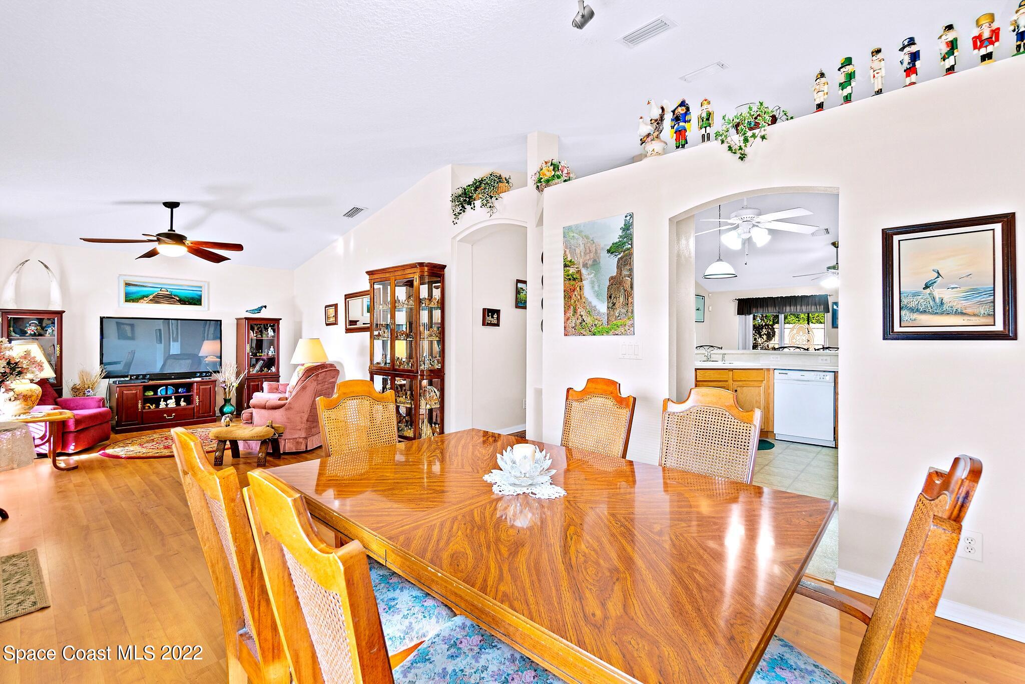 5449 Flint Road Cocoa, FL 32927 - Photo 11 of 36 a living room with furniture and flat screen tv