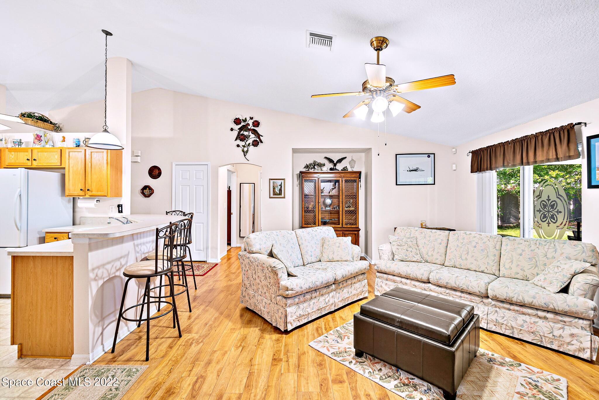 5449 Flint Road Cocoa, FL 32927 - Photo 13 of 36 a living room with furniture and a large window