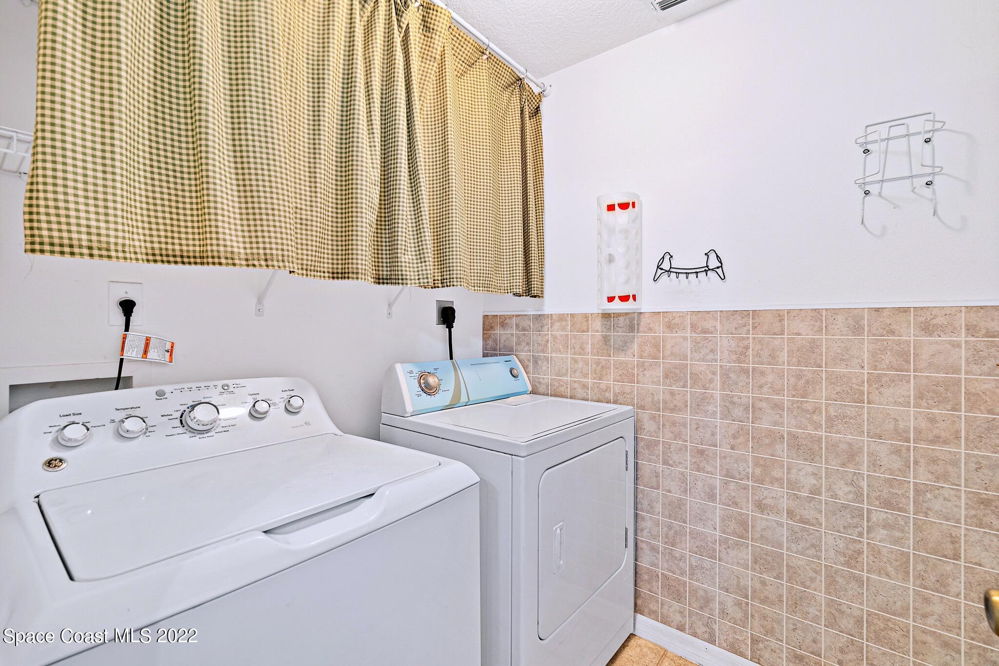 5449 Flint Road Cocoa, FL 32927 - Photo 26 of 36 a bathroom with a sink and a window