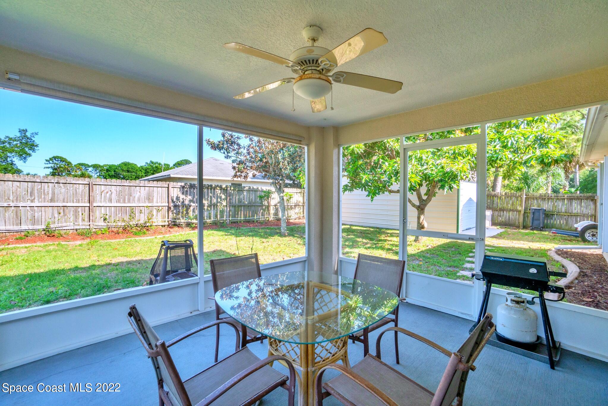 5449 Flint Road Cocoa, FL 32927 - Photo 27 of 36 a view of a swimming pool an outdoor seating space