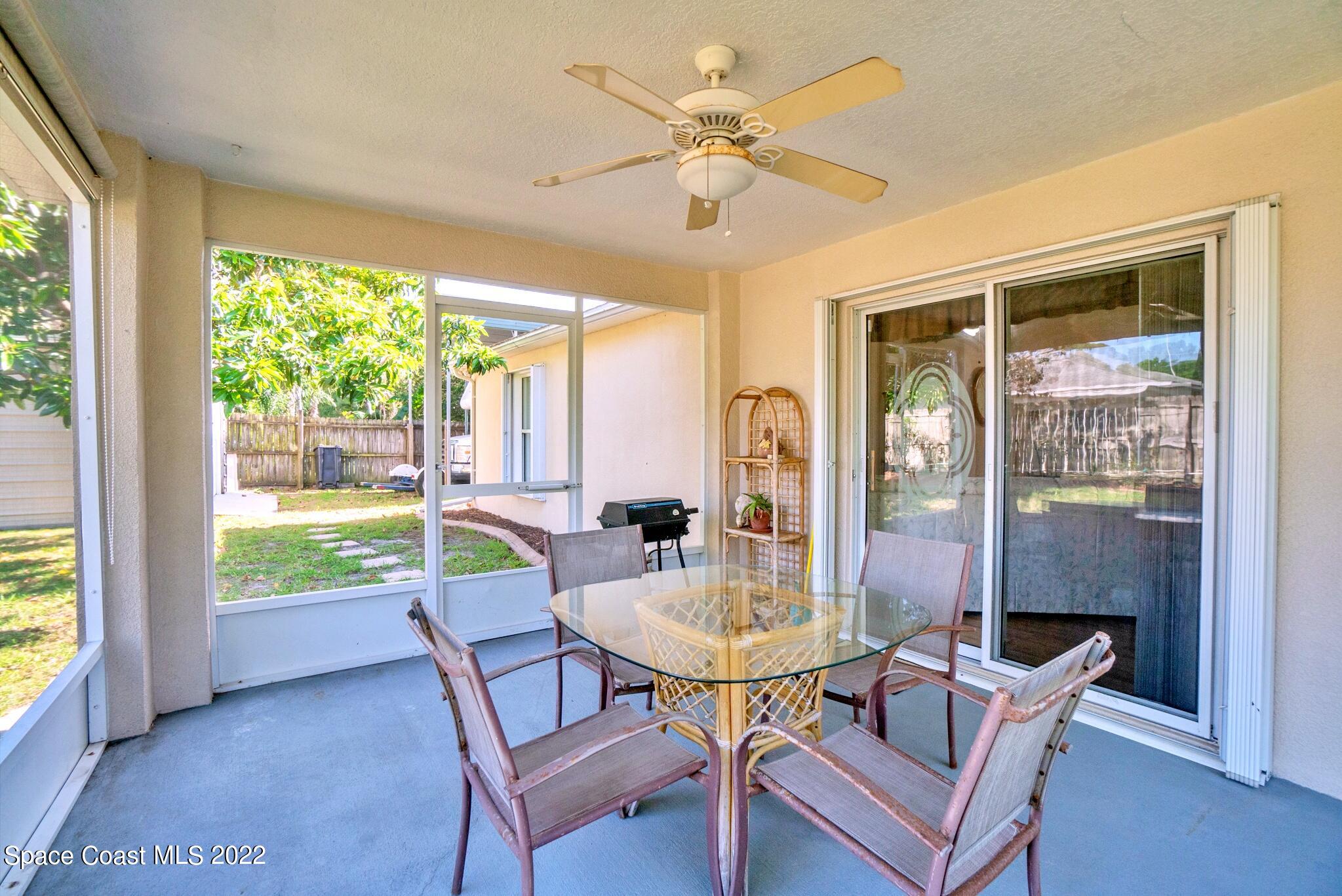 5449 Flint Road Cocoa, FL 32927 - Photo 29 of 36 a view of a dining room with furniture window and outside view