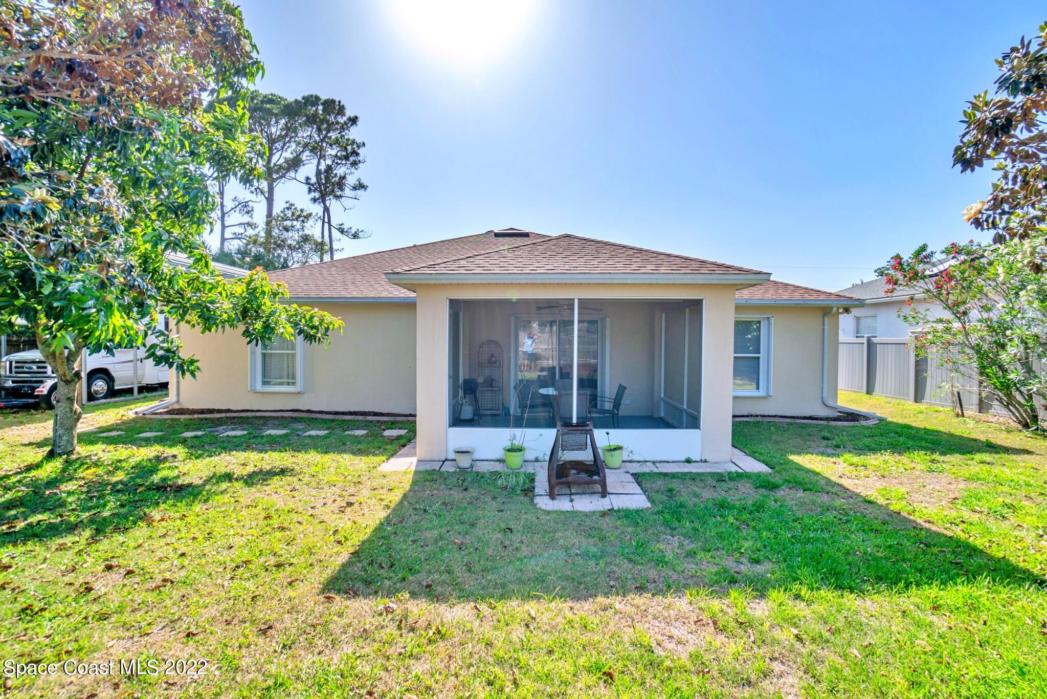 5449 Flint Road Cocoa, FL 32927 - Photo 31 of 36 a front view of a house with garden