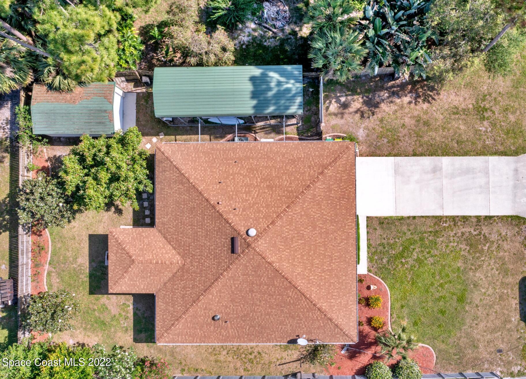 5449 Flint Road Cocoa, FL 32927 - Photo 35 of 36 an aerial view of a house with a yard basket ball court and outdoor seating
