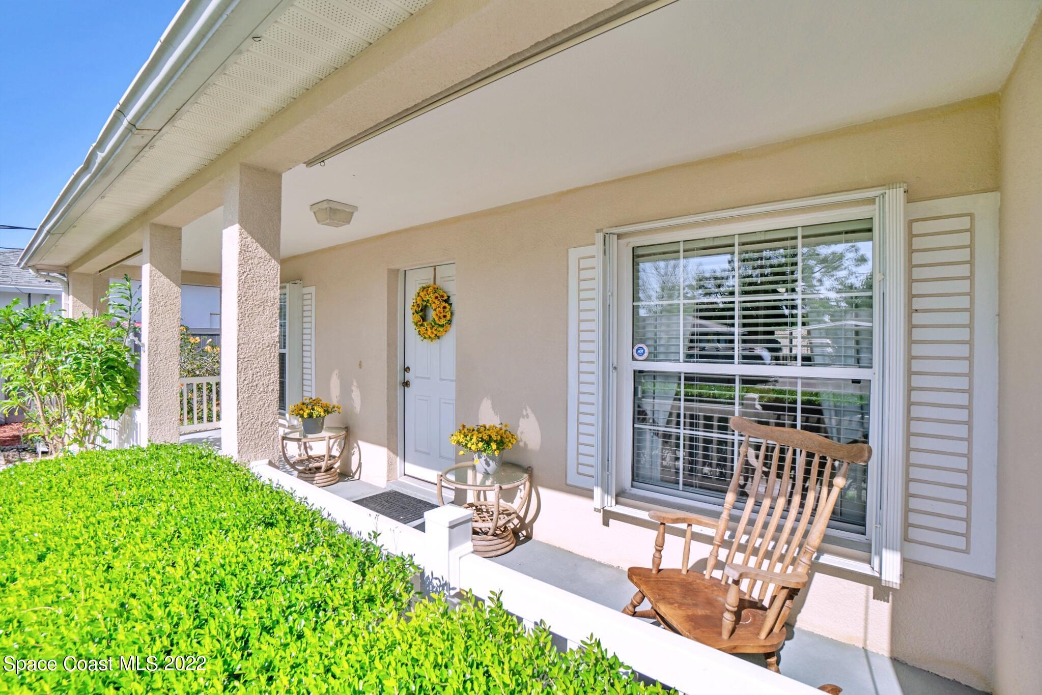 5449 Flint Road Cocoa, FL 32927 - Photo 6 of 36 a view of a patio with table and chairs and potted plants