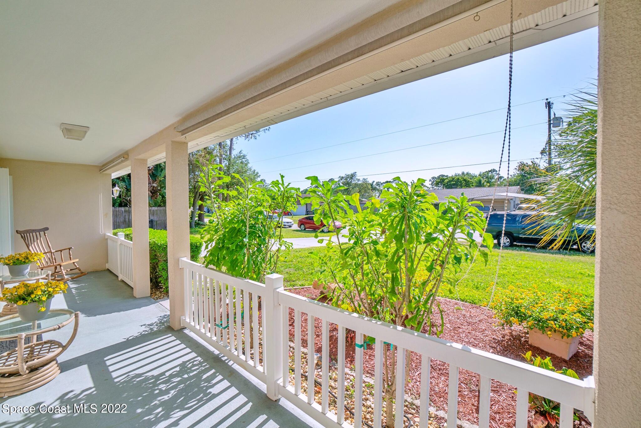 5449 Flint Road Cocoa, FL 32927 - Photo 7 of 36 a view of a porch with chairs