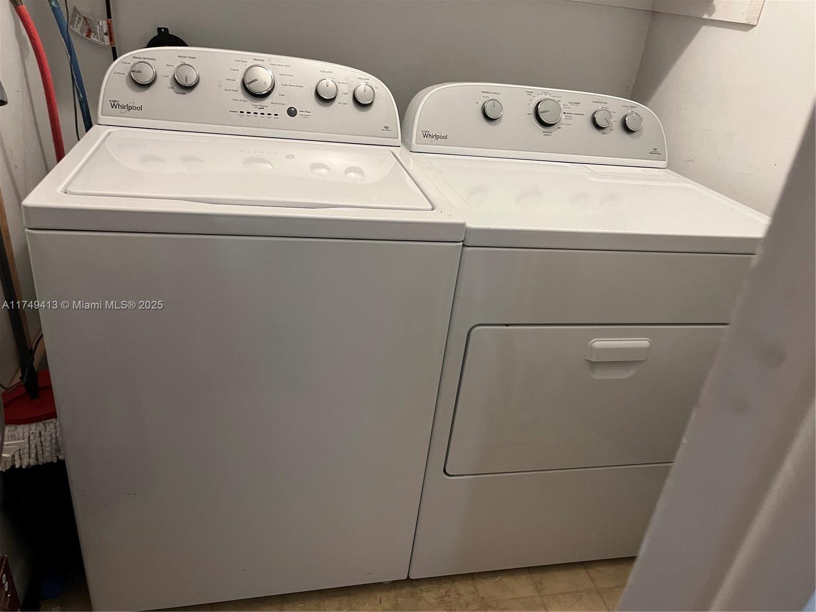3924 Southwest 67th Terrace, Unit 117 Davie, FL 33314 - Photo 7 of 18 a close up view of washer and dryer