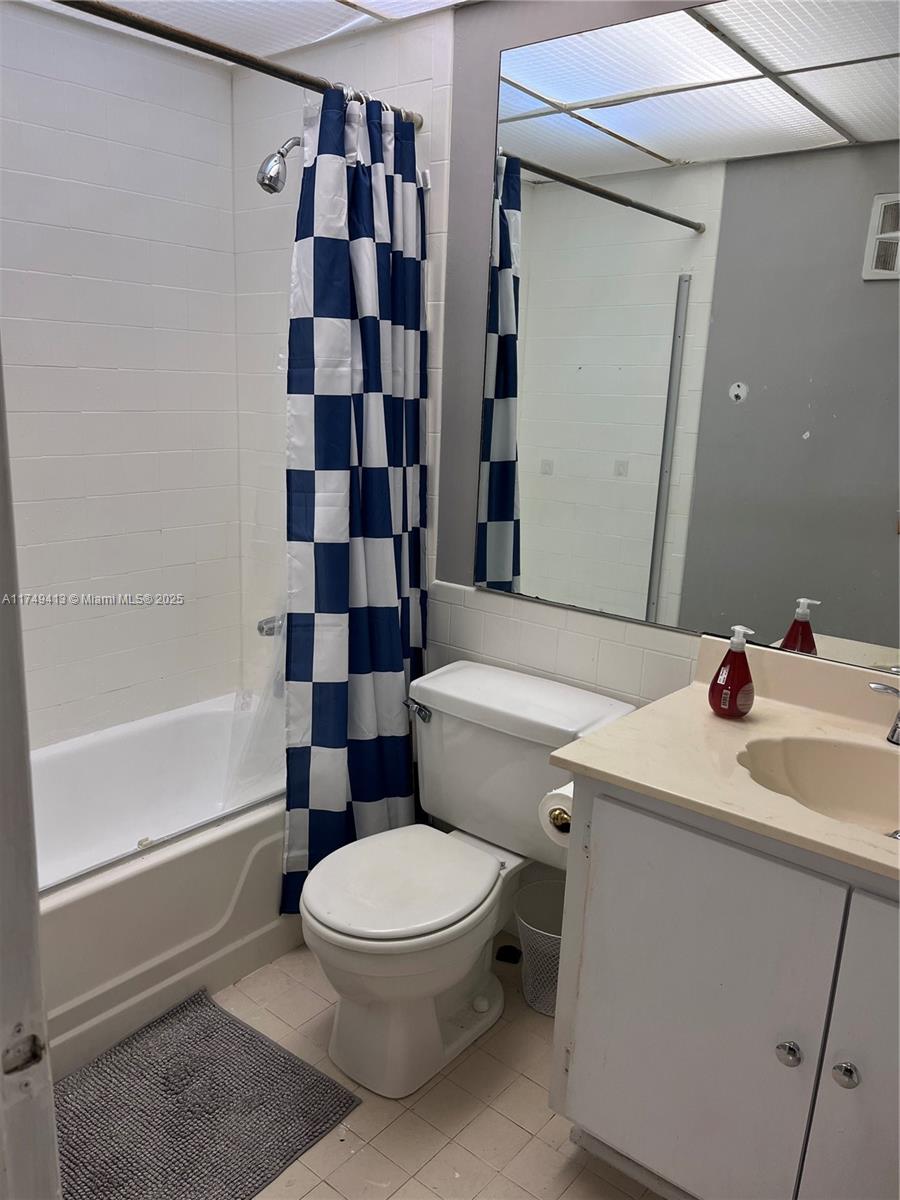 3924 Southwest 67th Terrace, Unit 117 Davie, FL 33314 - Photo 10 of 18 a white toilet sitting next to a bathroom sink