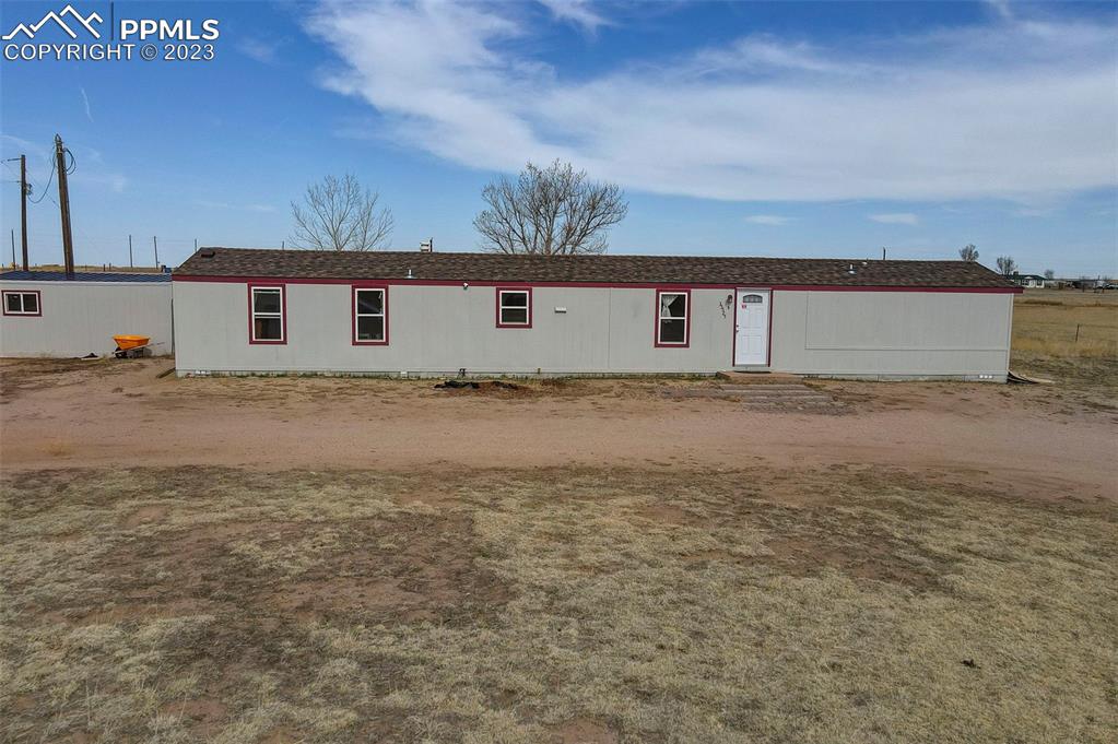 35525 Fossinger Road Yoder, CO 80864 - Photo 6 of 38 a view of a house with a yard