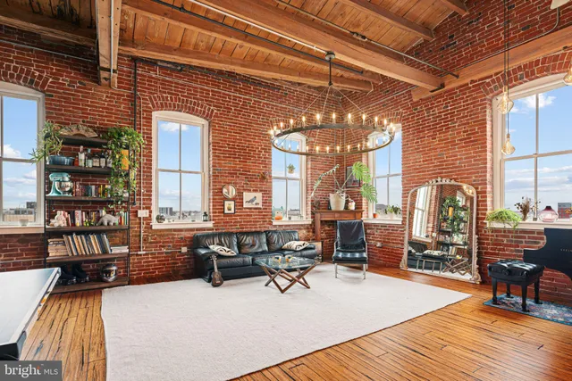 a view of a gym with pool table and chairs