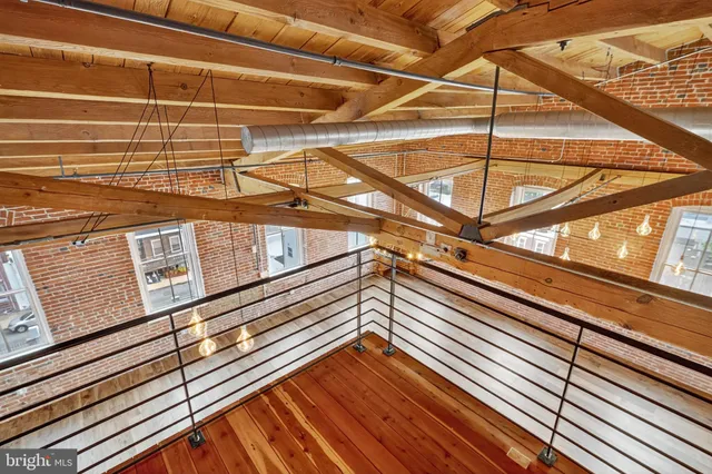 a view of room with wooden floor