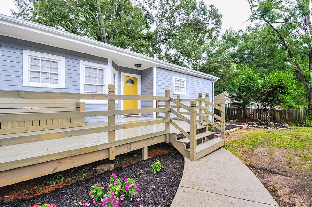 1668 Sylvan Road Southwest Atlanta, GA 30310 - Photo 1 of 1 a view of a backyard with chairs and potted plants