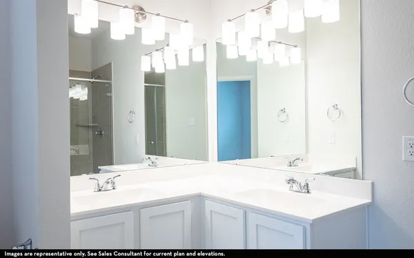 a bathroom with a sink vanity and a mirror