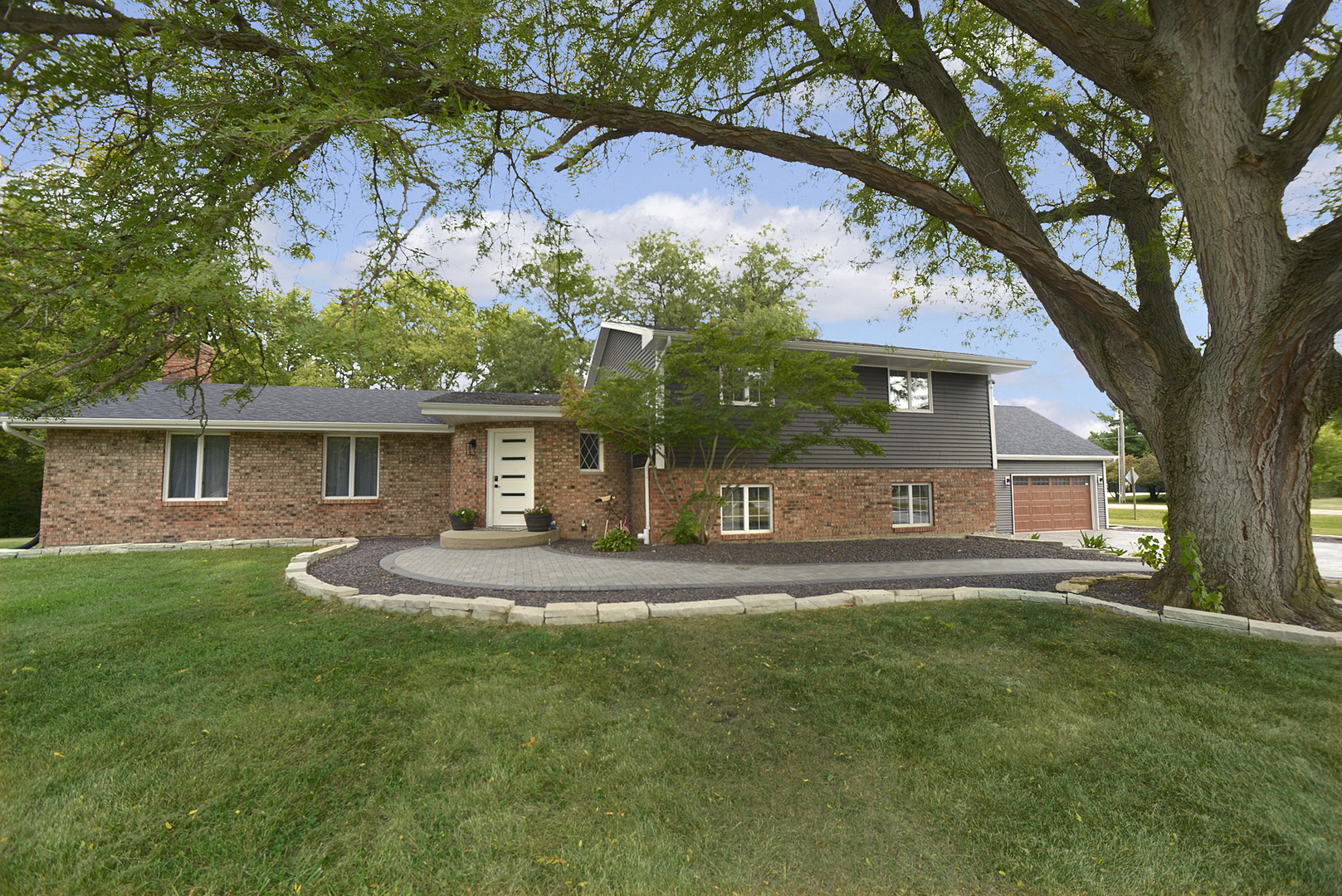 front view of a house with a yard