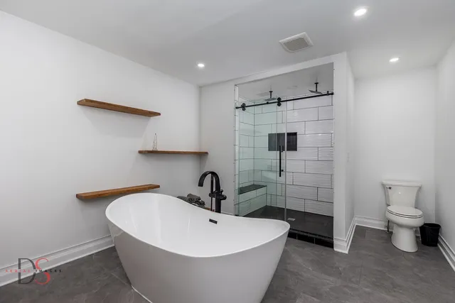 a workspace with wooden floor and a ceiling fan