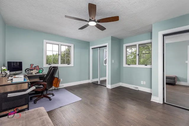 a bedroom with a bed and a bookshelf