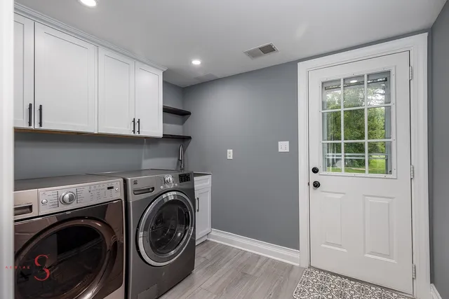 a room with furniture pool table and a fireplace