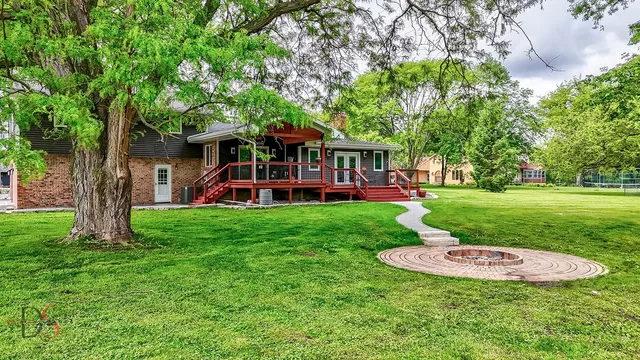 a backyard of a house with seating space