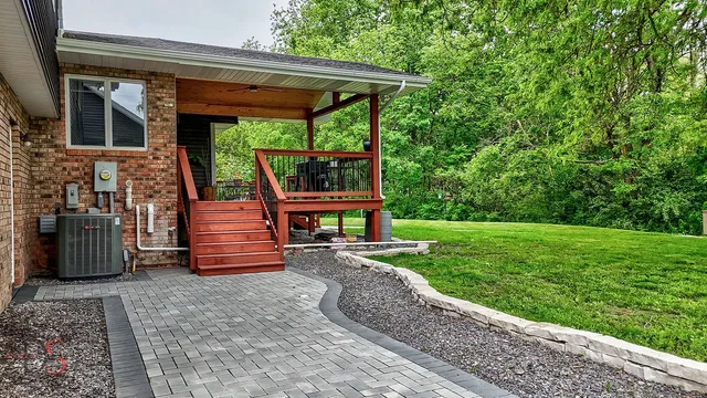 a front view of a house with a yard and a garage