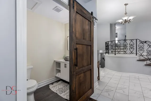 a bathroom with a bathtub and toilet