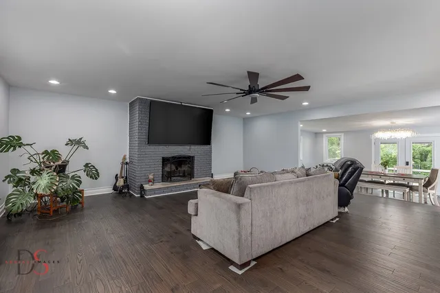 a living room with furniture and a fireplace
