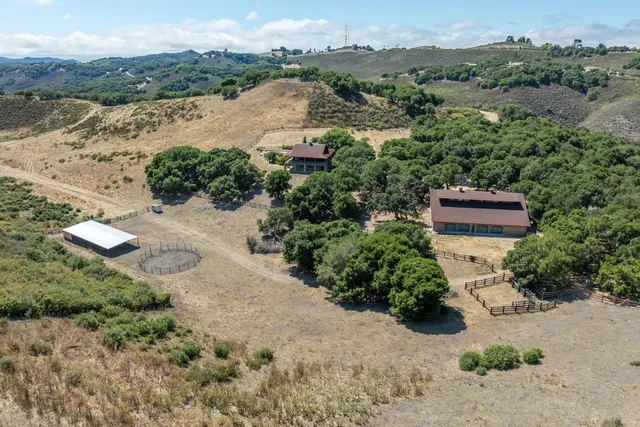 an aerial view of mountain with beach