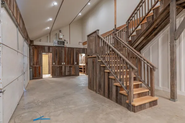 a view of entryway with stairs and wooden floor