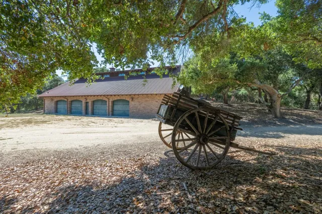 a house that has sitting area in front of a house