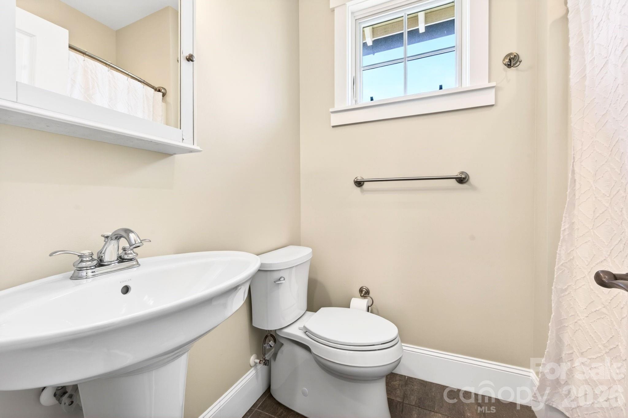 4 Fitzgerald Road Black Mountain, NC 28711 - Photo 20 of 43 a bathroom with a sink a toilet and a mirror