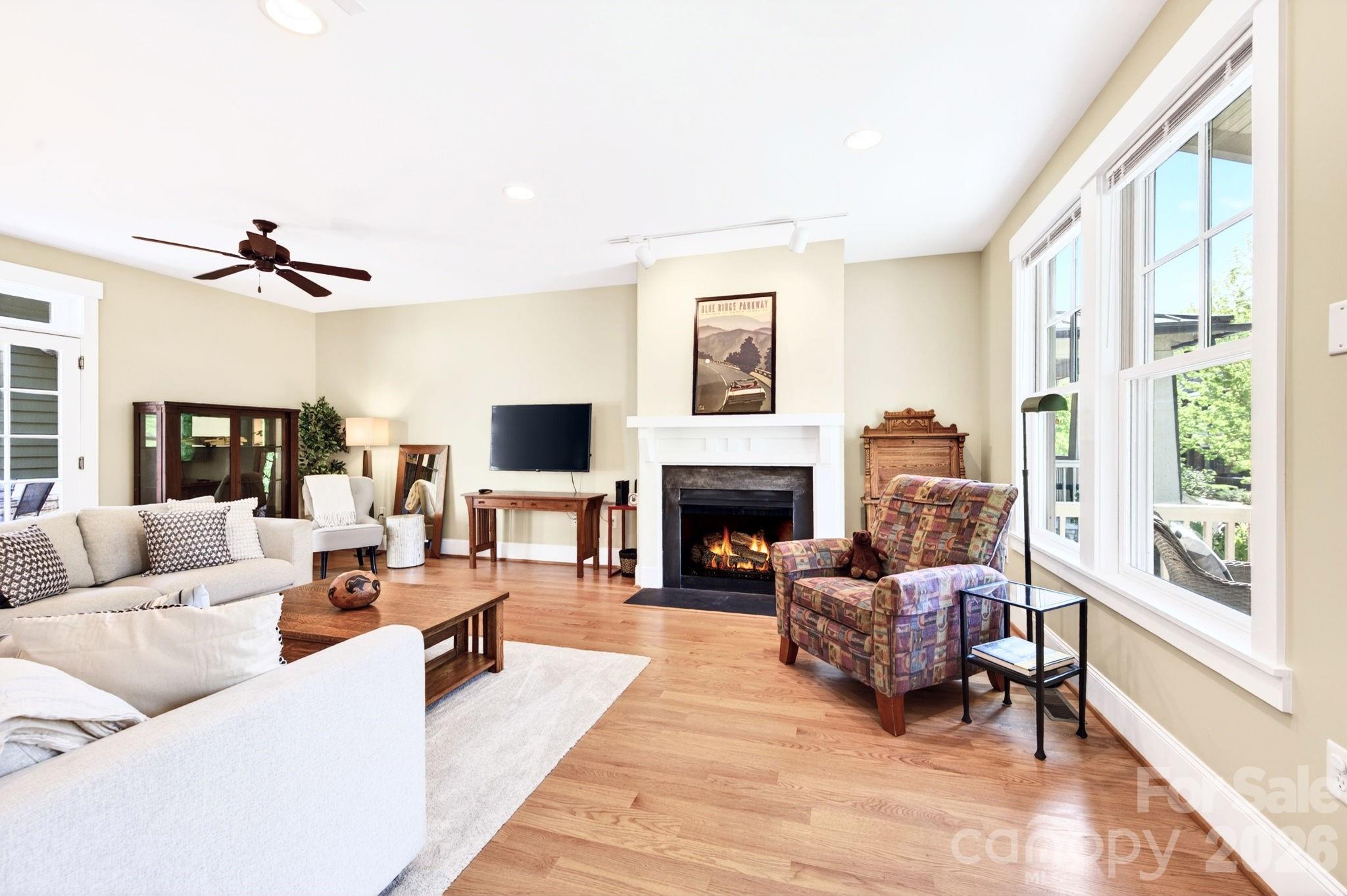 4 Fitzgerald Road Black Mountain, NC 28711 - Photo 5 of 43 a living room with furniture large window and a fireplace