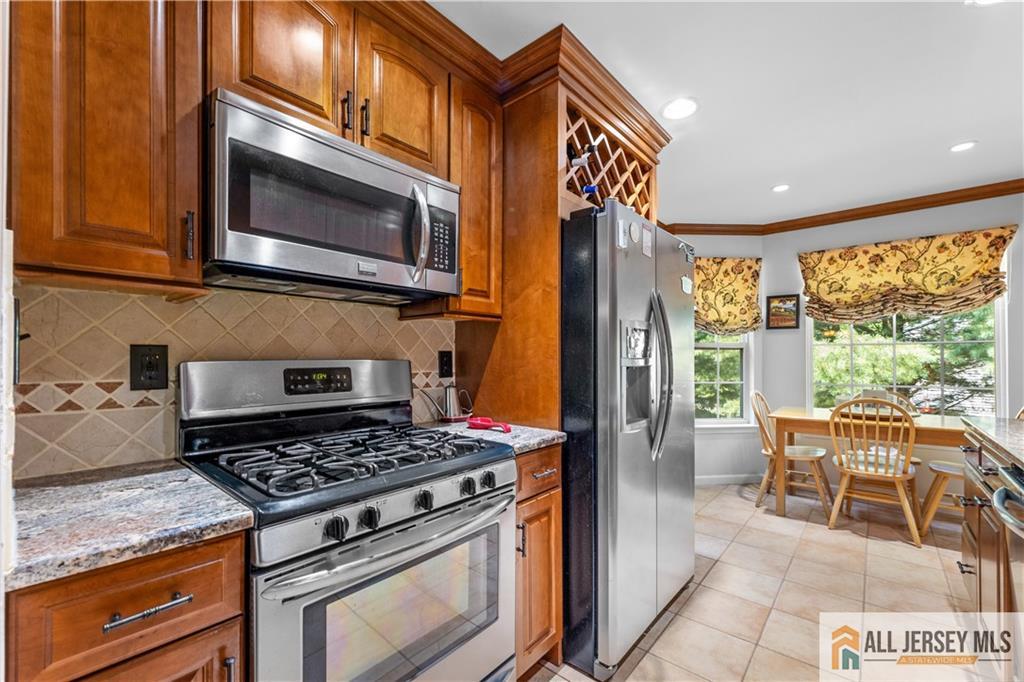28 Garfield Way Princeton, NJ 08540 - Photo 16 of 39 a kitchen with a stove and a microwave