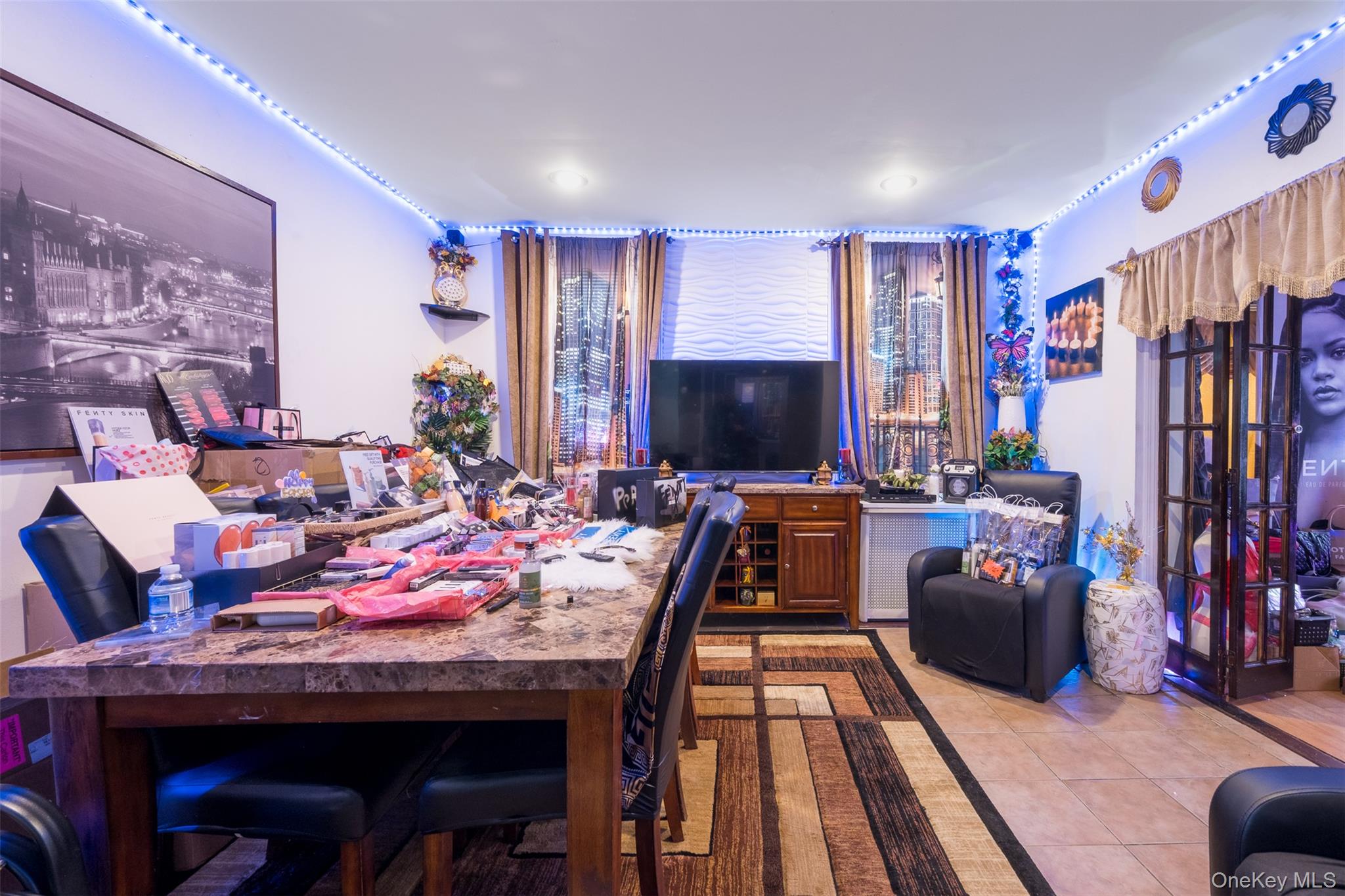 2541 Holland Avenue Bronx, NY 10467 - Photo 3 of 16 a living room with furniture and a flat screen tv