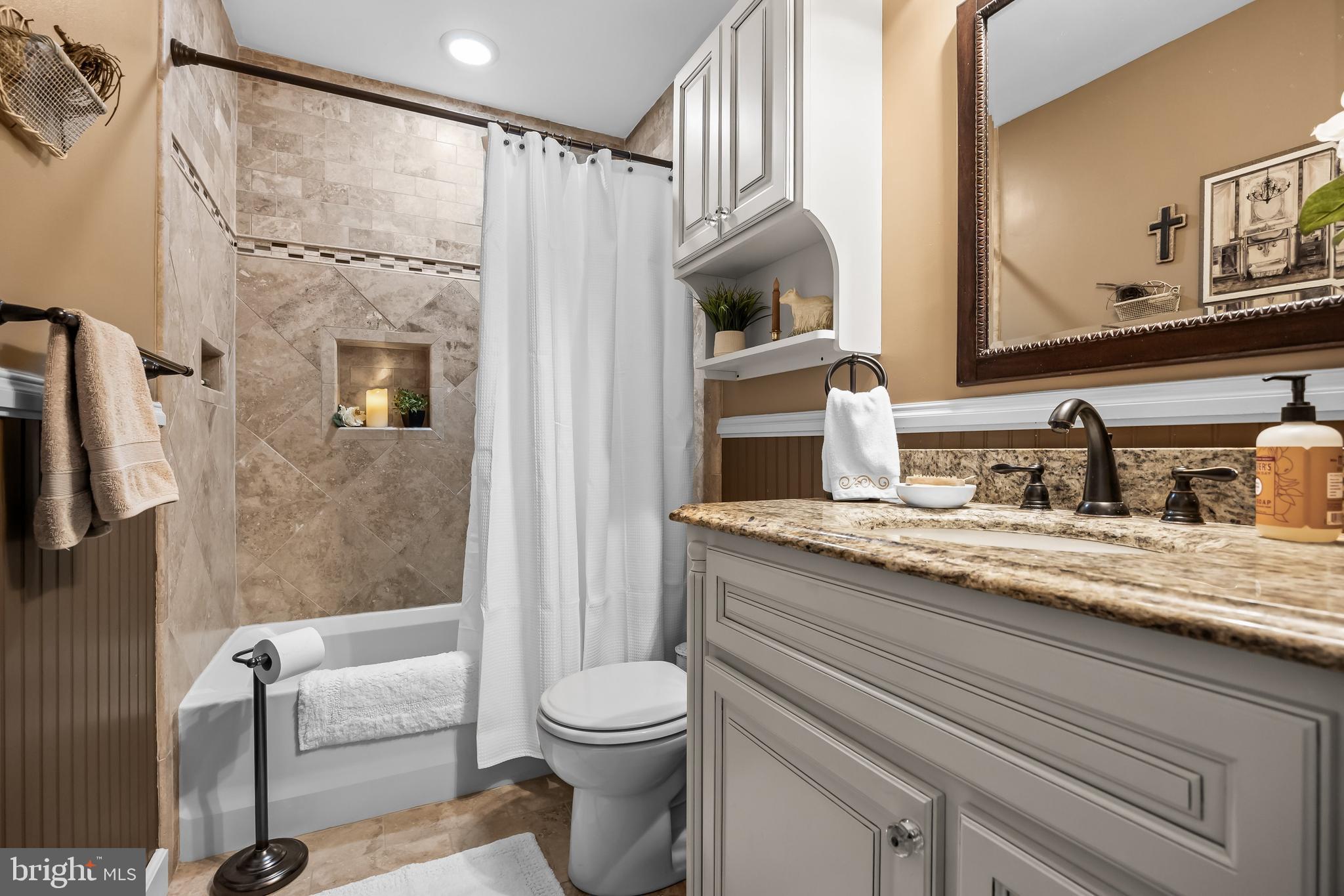 50 Brighton Road Westampton, NJ 08060 - Photo 21 of 35 a bathroom with a granite countertop sink a mirror a toilet and shower