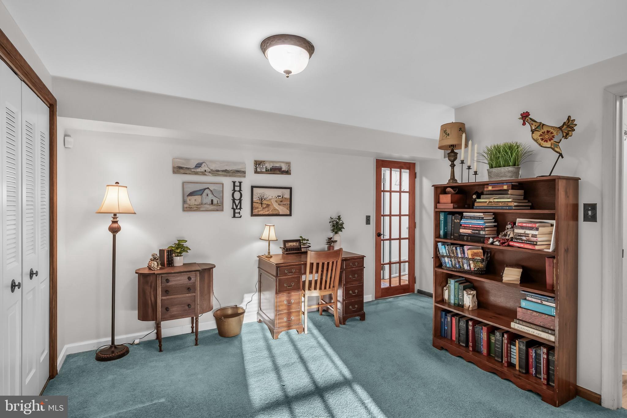 50 Brighton Road Westampton, NJ 08060 - Photo 22 of 35 a living room with lots of furniture and book shelf