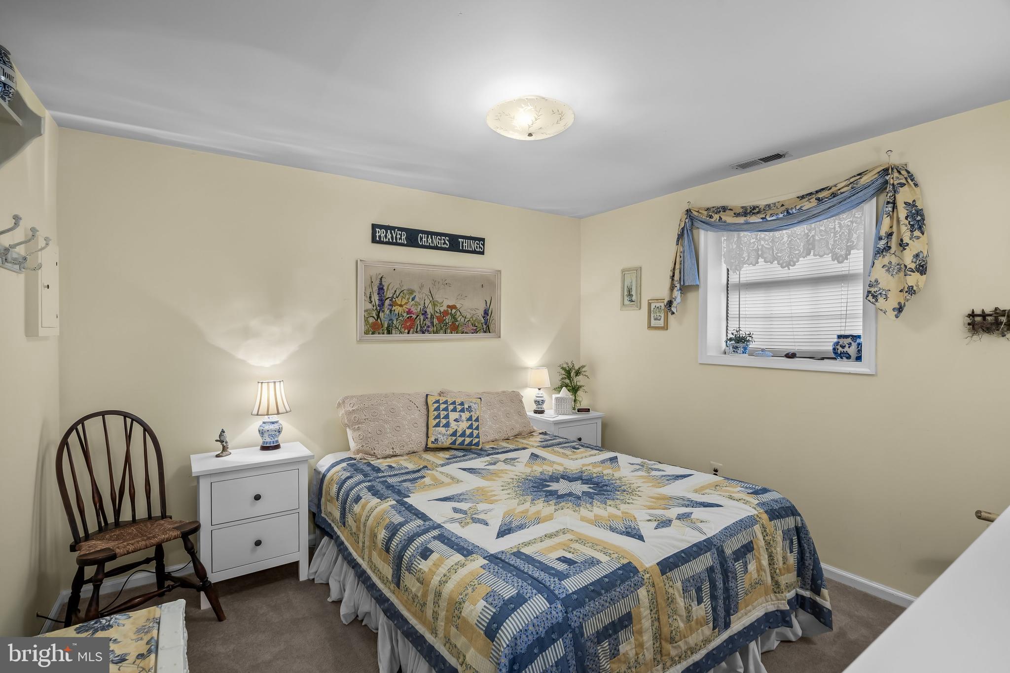 50 Brighton Road Westampton, NJ 08060 - Photo 26 of 35 a bedroom with a bed and a chandelier