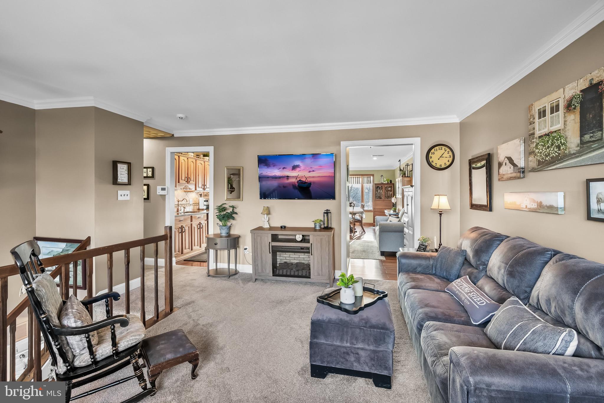 50 Brighton Road Westampton, NJ 08060 - Photo 9 of 35 a living room with furniture a flat screen tv and a fireplace