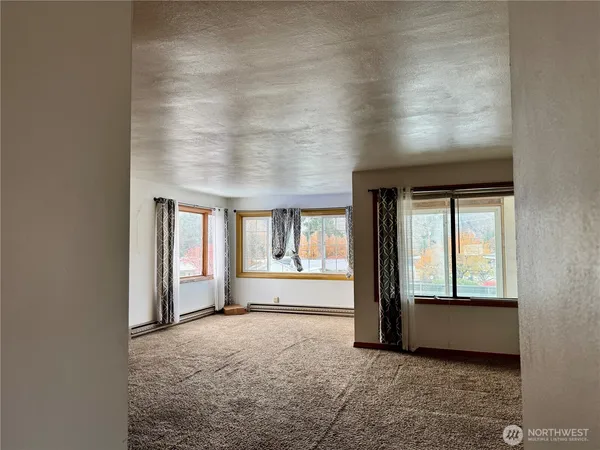 an empty room with windows