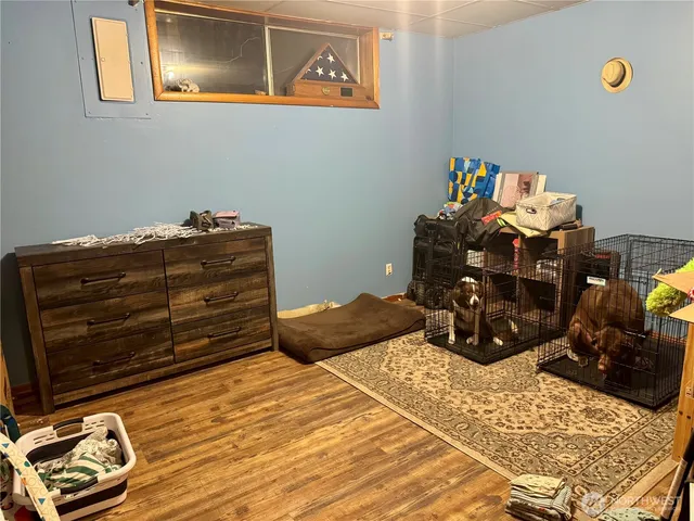 a bed room with a bed and a dresser