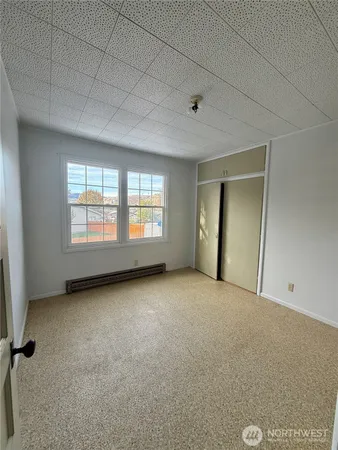 a view of an empty room with a window
