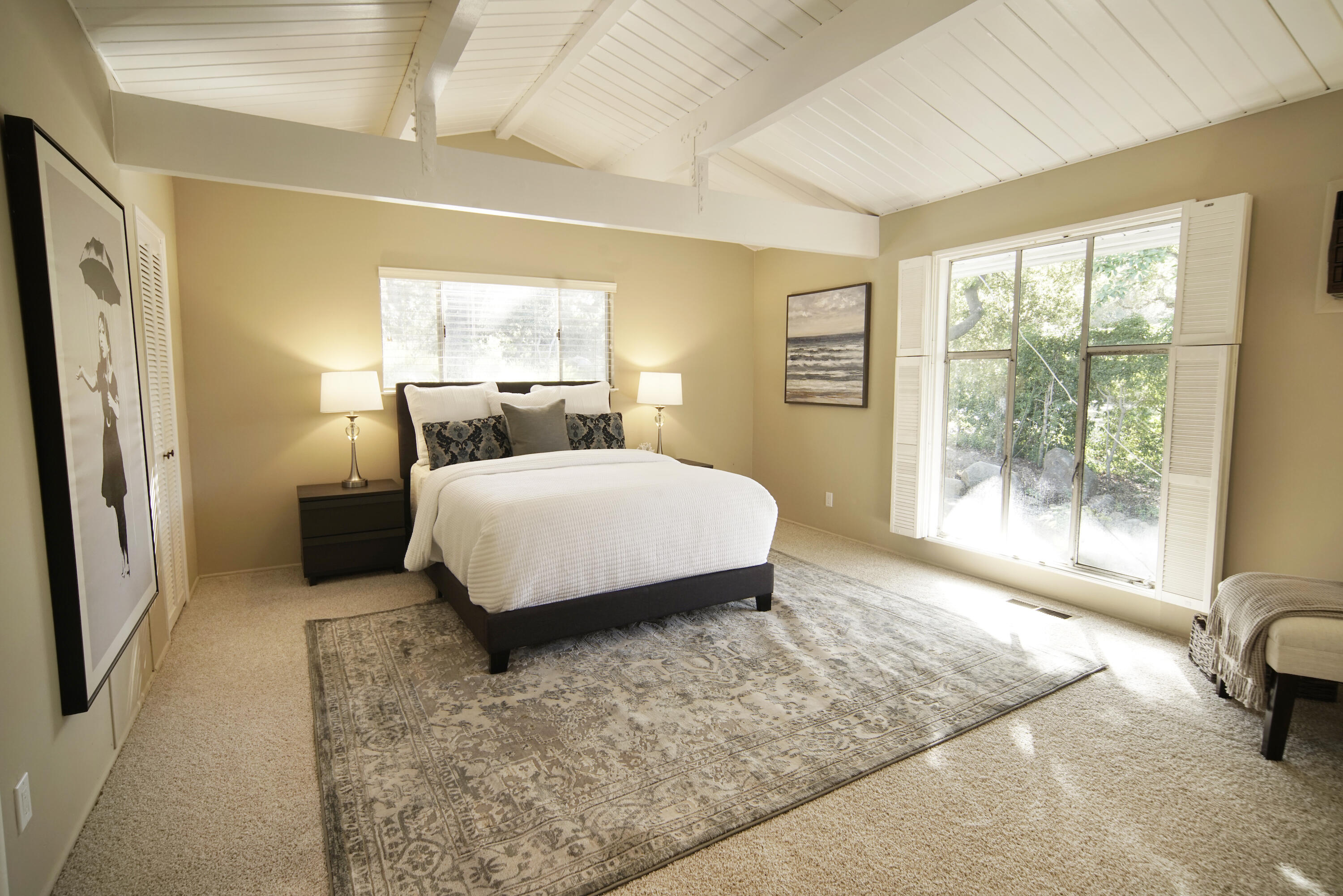 939 Mission Ridge Road Santa Barbara, CA 93103 - Photo 14 of 24 a bedroom with a bed and glass window