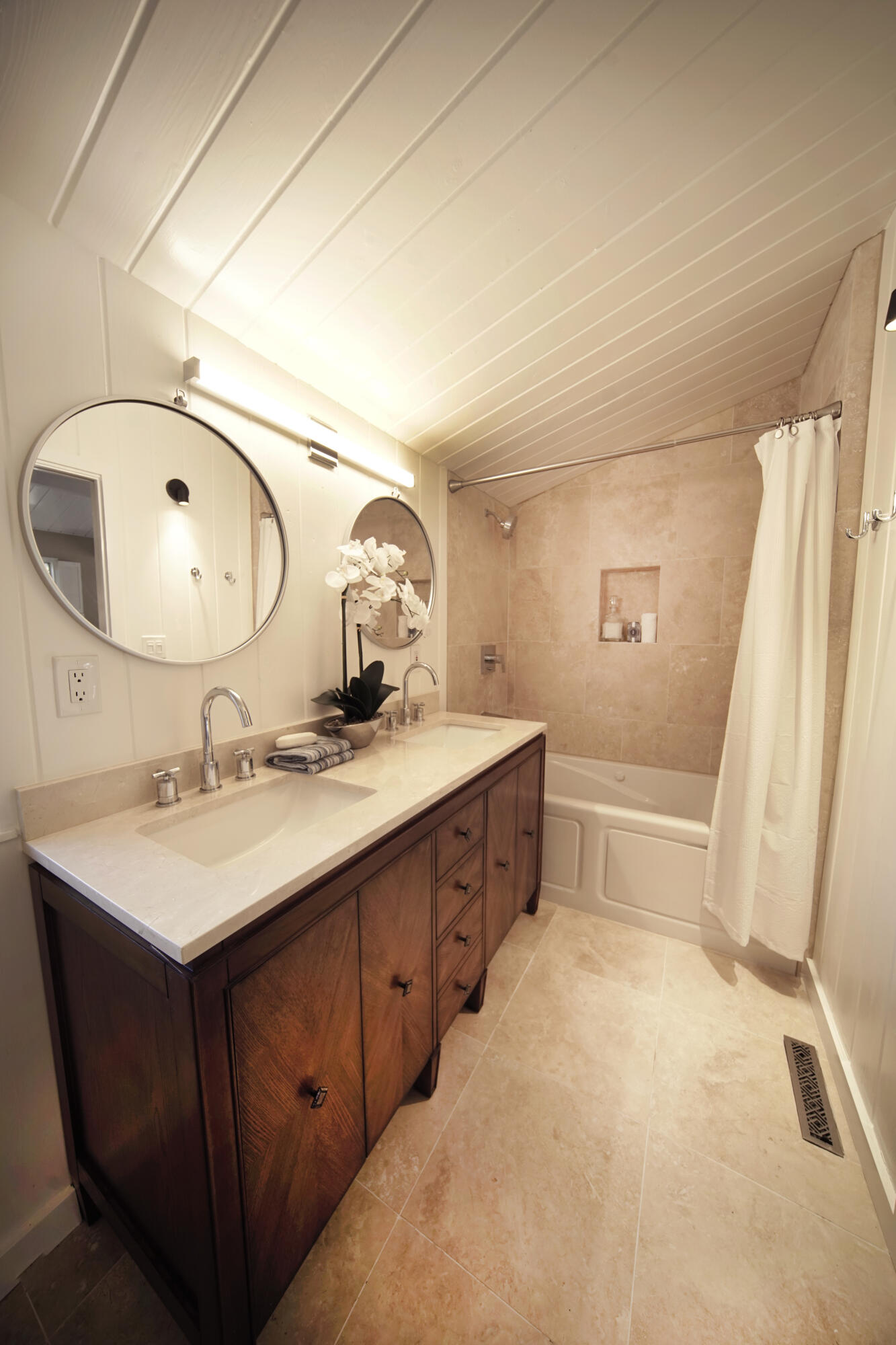 939 Mission Ridge Road Santa Barbara, CA 93103 - Photo 17 of 24 a bathroom with a double vanity sink and a mirror