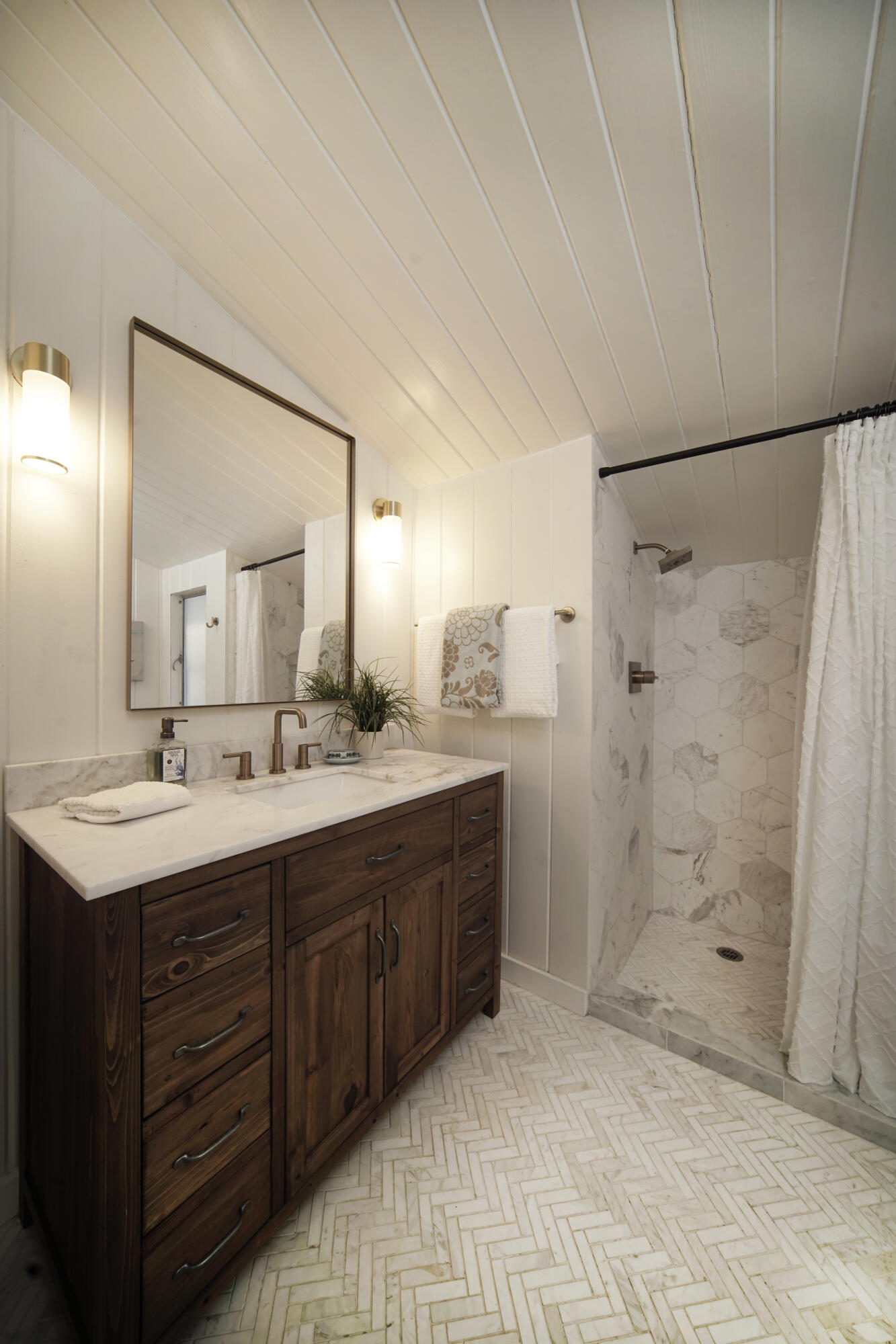 939 Mission Ridge Road Santa Barbara, CA 93103 - Photo 19 of 24 a bathroom with a double vanity sink mirror and shower