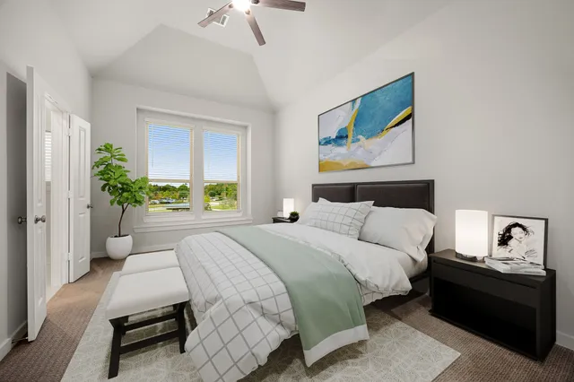 an aerial view of ocean and residential houses with outdoor space