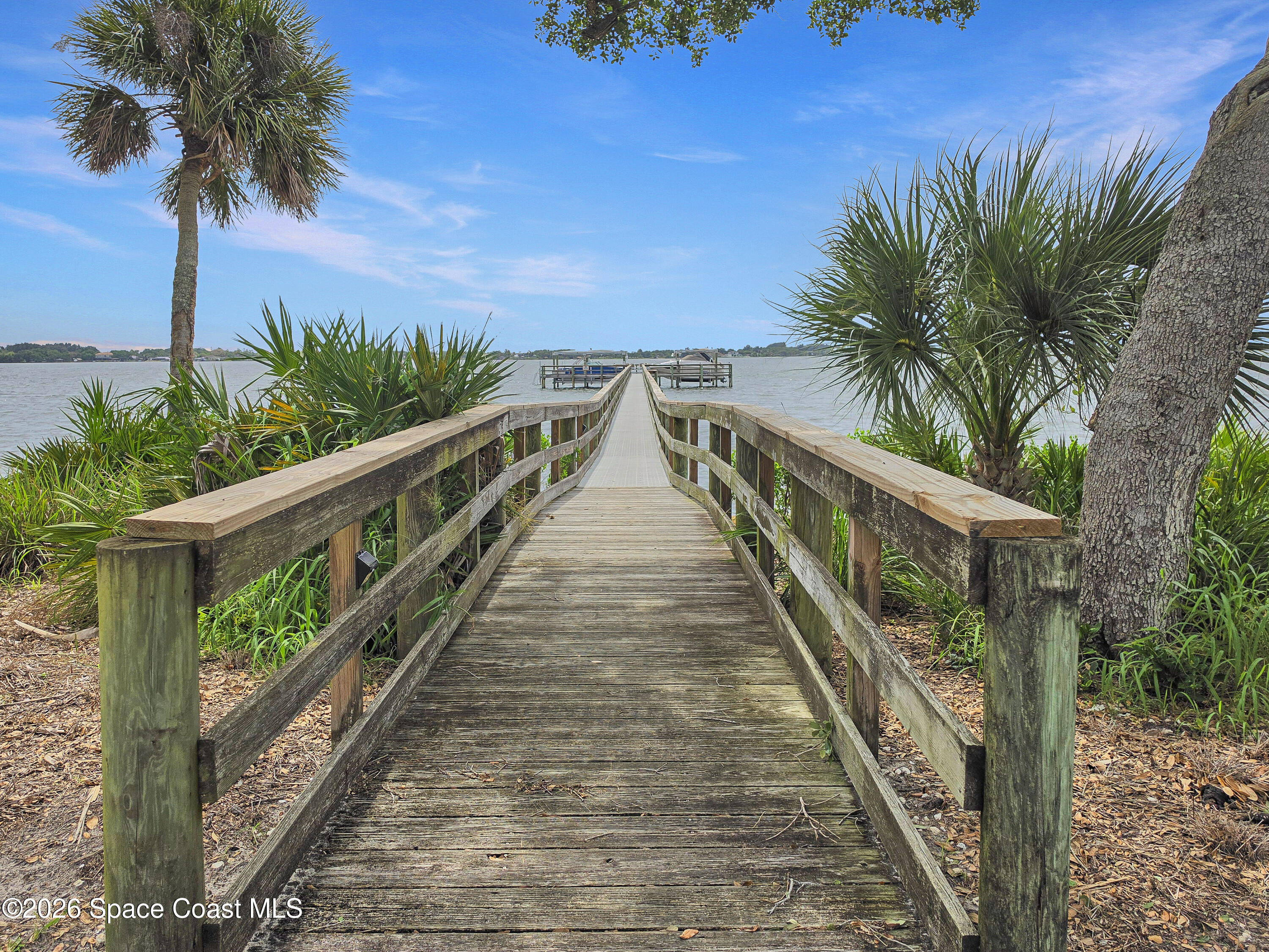 6005 Highway 1, Unit 101 Rockledge, FL 32955 - Photo 41 of 57 a view of balcony with wooden floor and fence