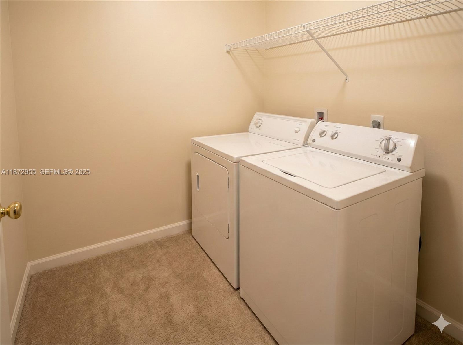 4201 West McNab Road, Unit 27 Pompano Beach, FL 33069 - Photo 15 of 15 a utility room with dryer and washer