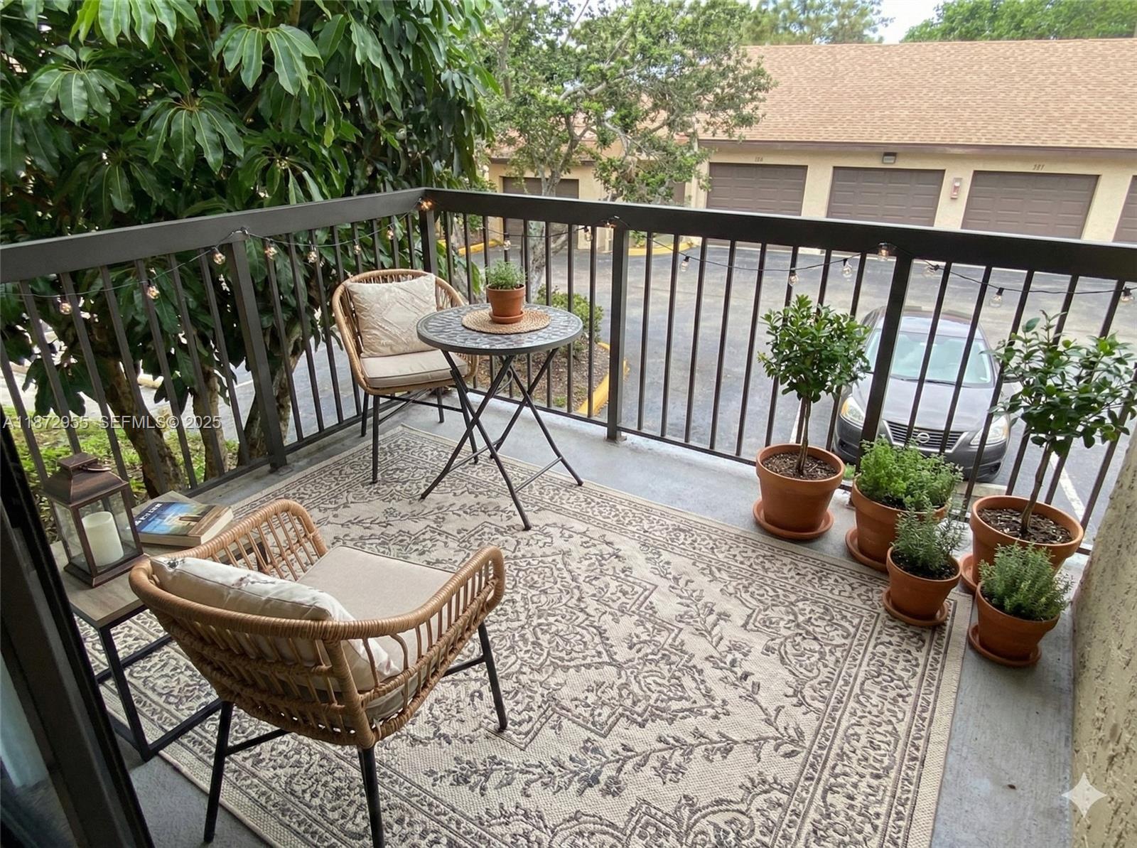 4201 West McNab Road, Unit 27 Pompano Beach, FL 33069 - Photo 8 of 15 a view of a chairs and table in the balcony