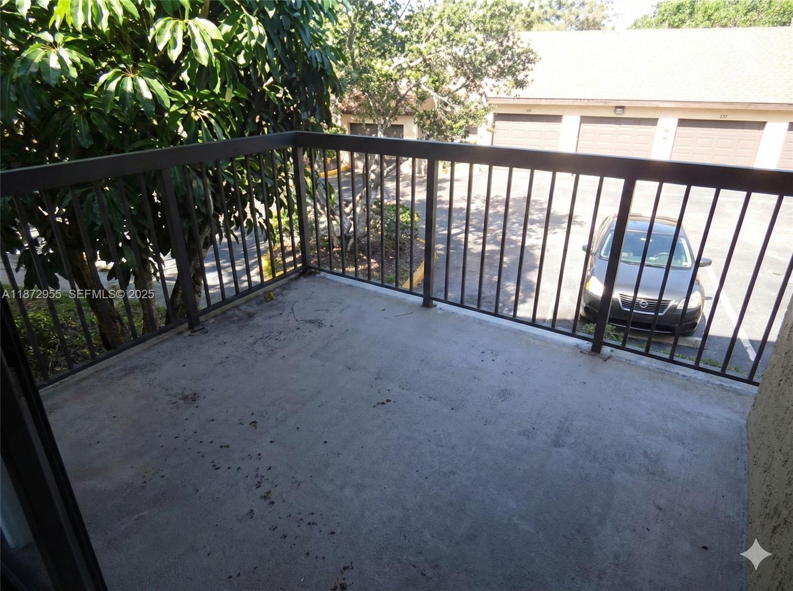 4201 West McNab Road, Unit 27 Pompano Beach, FL 33069 - Photo 9 of 15 a view of balcony with floor to ceiling window