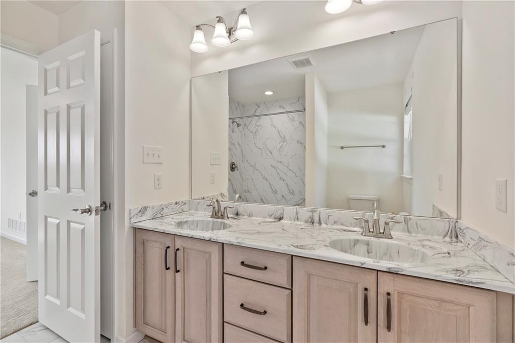 203 Southview Road Pittsburgh, PA 15237 - Photo 14 of 34 a bathroom with a granite countertop double vanity sink and a mirror